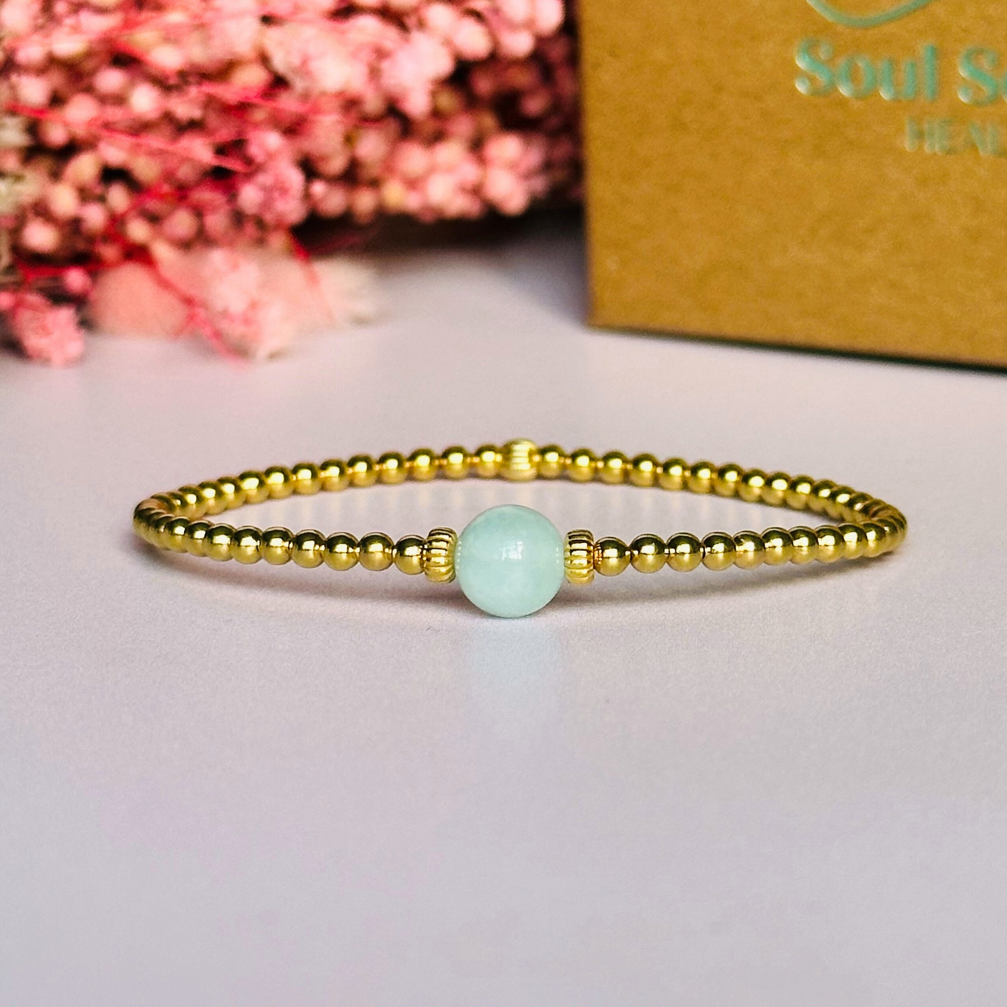 Gold vermeil aquamarine bracelet features an ethically mined 8mm aquamarine bead, flanked by corrugated rondelle beads on a band of 3mm gold vermeil beads. A bracelet to promote courage and self expression.