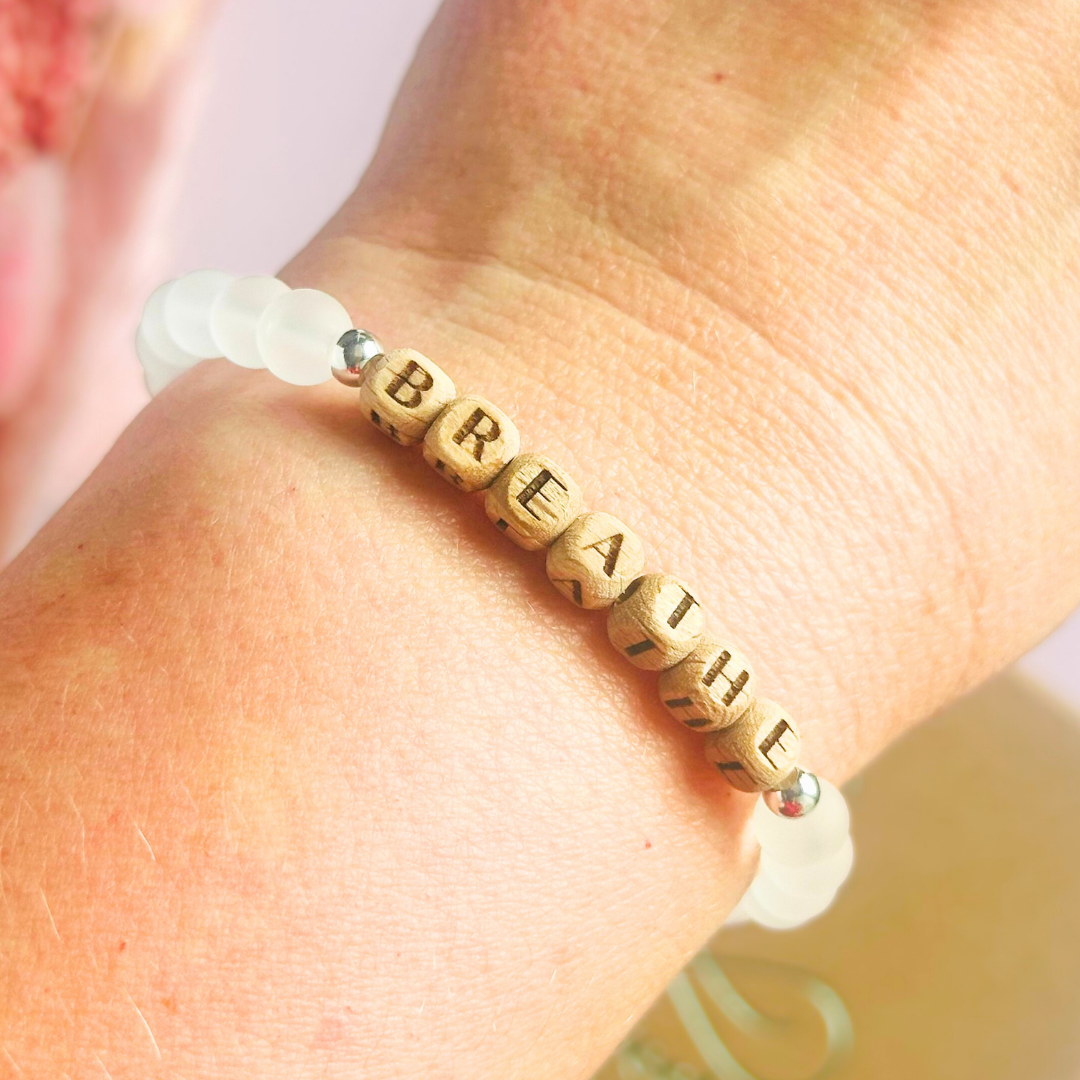 Breathwork bracelet featuring 6mm and 8mm frosted clear quartz crystal beads that follow the 4-7-8 counted breathing method. Also featuring laser engraved wooden letter beads spelling out the word BREATHE. Choose your accent beads from rose gold vermeil, gold vermeil or sterling silver.