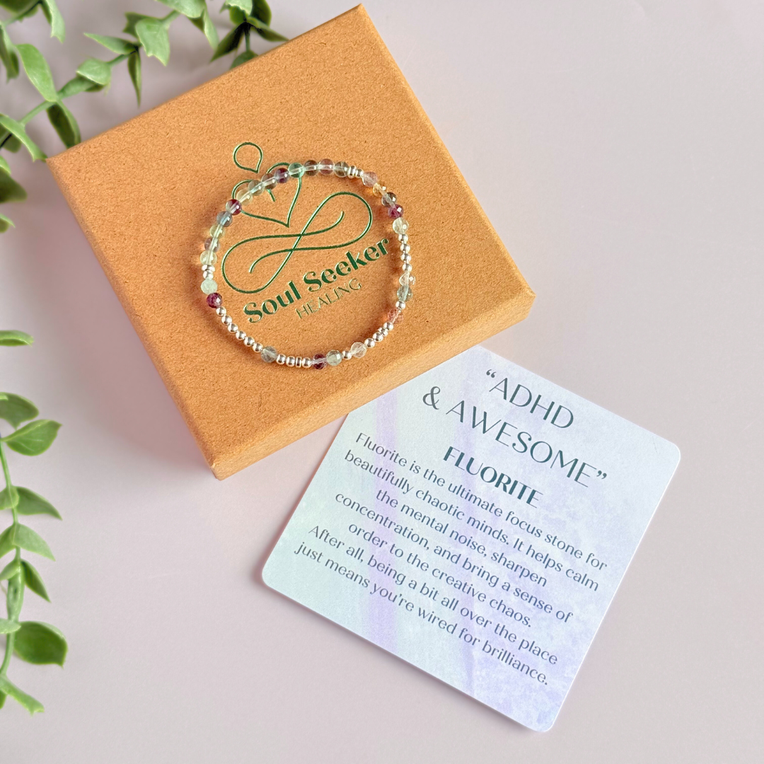 Elasticated stretch fluorite crystal morse code bracelet spelling out the words ‘ADHD and awesome’ in a combination of 4mm round fluorite beads, 4mm faceted fluorite beads and either sterling silver or gold vermeil 3mm round beads. The words start and end at the rondelle spacer beads.