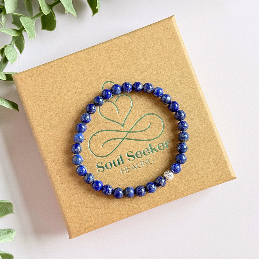 Genuine lapis lazuli bracelet featuring 6mm, smooth, round dark blue lapis lazuli beads and your choice of a 6mm faceted gold vermeil or sterling silver accent bead. Elasticated for comfort.