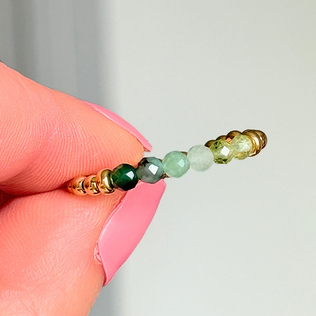 Gold vermeil band style ombré ring with multicolour 3mm faceted peridot, green aventurine and emerald beads with a beaded band of 2.5 mm gold vermeil round beads. Elasticated for comfort.