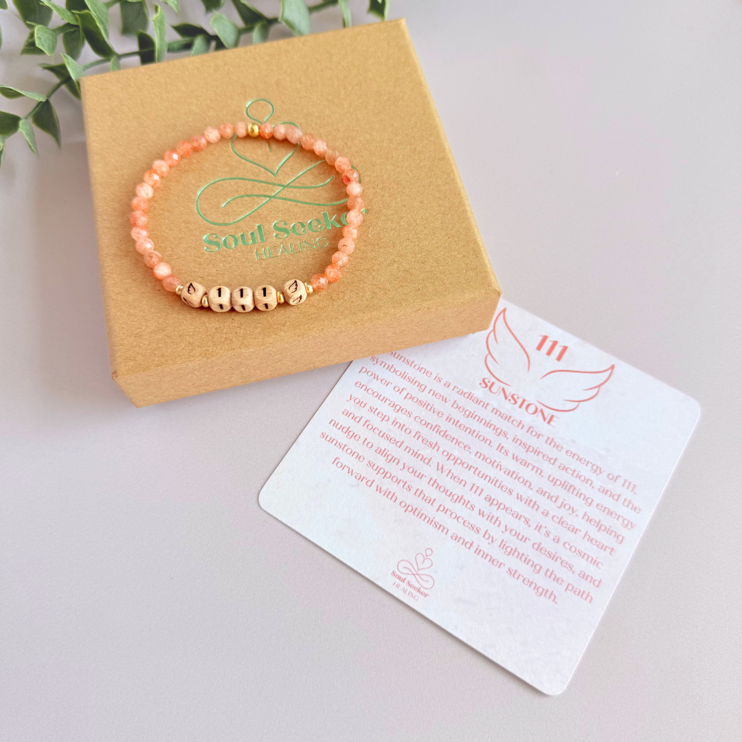 Bracelet featuring engraved wooden 111 angel number and wing beads, on the band of 4mm faceted sunstone round crystal gemstone beads. Finished with your choice of gold vermeil, sterling silver or rose gold vermeil accent beads.