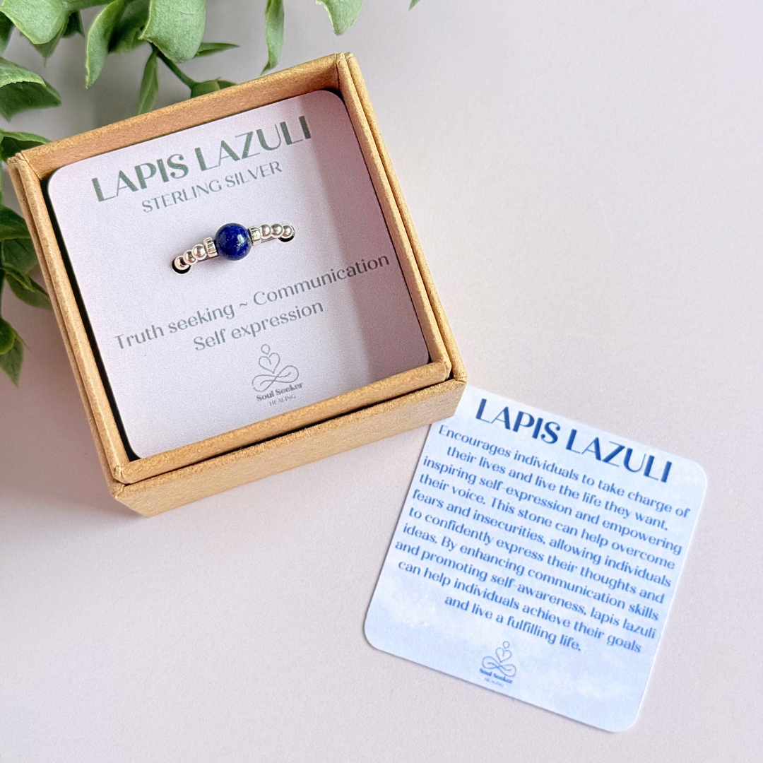 Sterling silver beaded ring featuring a 6mm lapis lazuli round bead, flanked by sterling silver corrugated beads. Elasticated for comfort.