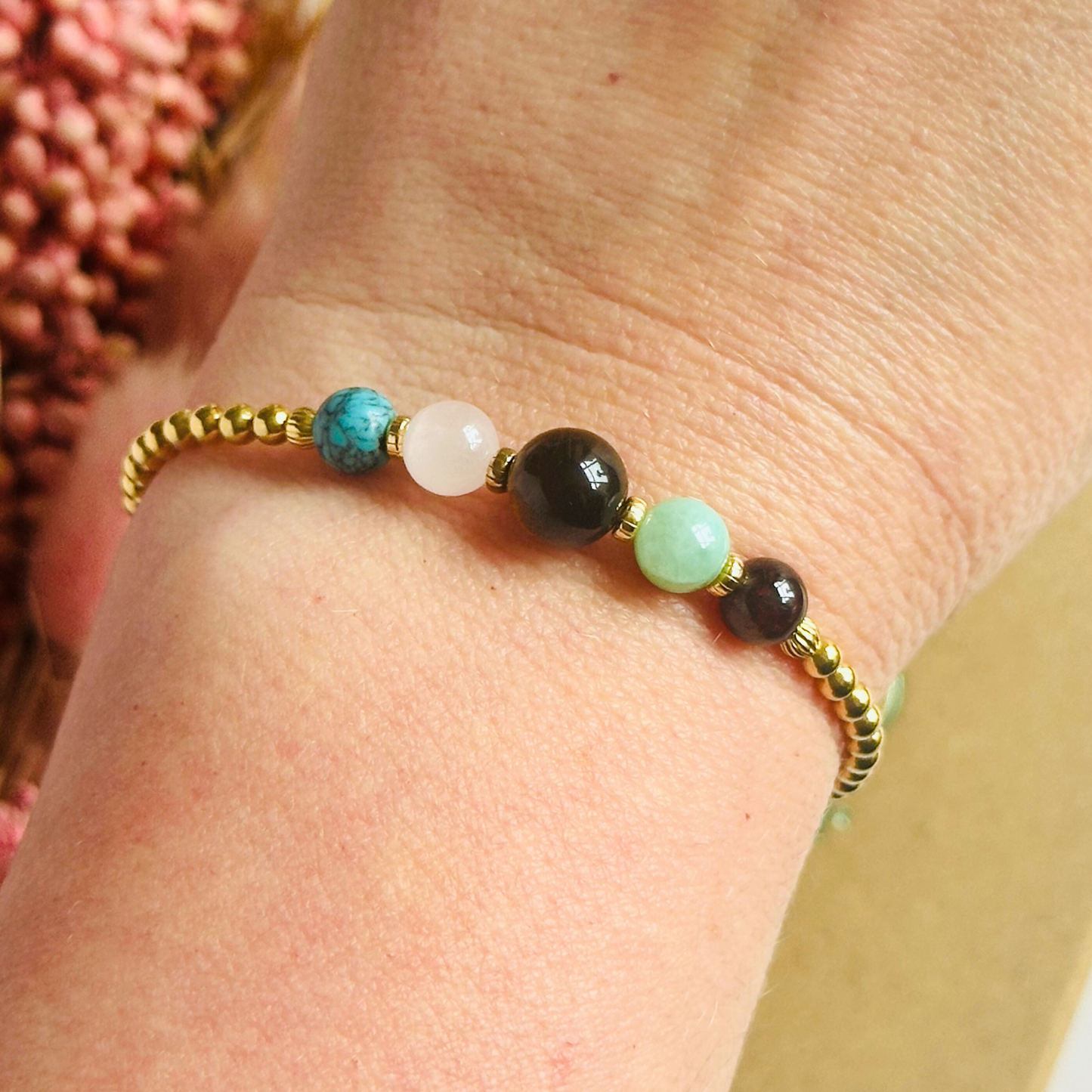 This gold vermeil Leo bracelet is made with a selection of five healing crystals all believed to resonate with the Leo zodiac sign. The central bead is 8mm, the other four are 6mm. On an elasticated band of 3mm gold vermeil beads with corrugated accent beads. Featuring chrysocolla, garnet, tigers eye, rose quartz and turquoise.