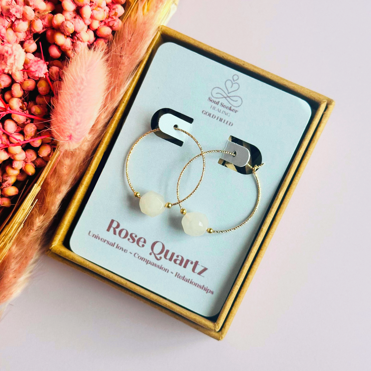 Rose Quartz gold filled hoop earrings featuring 8mm star cut rose quartz beads on 25mm sparkle cut gold filled hoops.