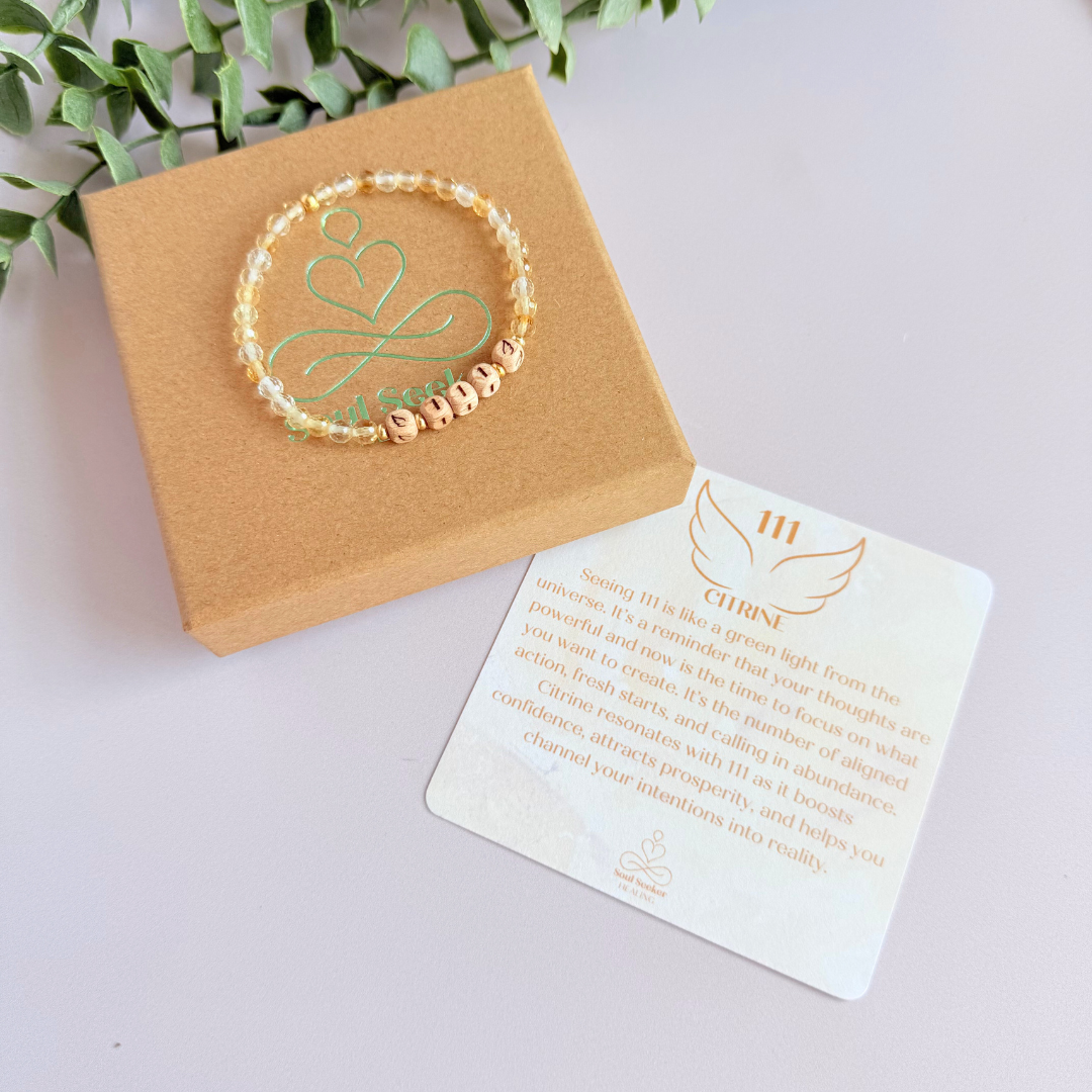 Bracelet featuring engraved wooden 111 angel number and wing beads, on the band of 4mm faceted citrine round crystal gemstone beads. Finished with your choice of gold vermeil, sterling silver or rose gold vermeil accent beads.