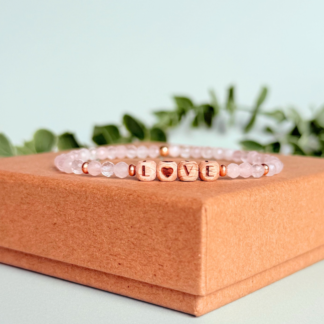 Bracelet featuring 5mm engraved wooden beads which you can personalise with your choice of words, numbers and symbols. The main the band of the bracelet is made with 4mm faceted rose quartz round crystal gemstone beads. Finished with your choice of gold vermeil, sterling silver or rose gold vermeil accent beads.