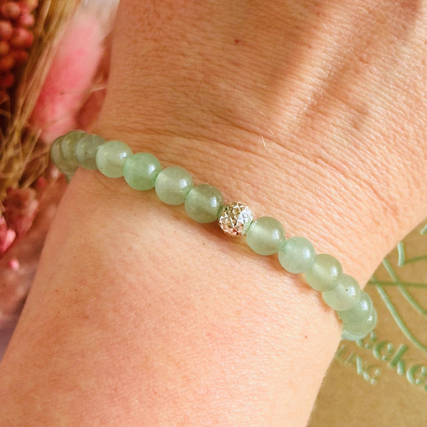 Green aventurine bracelet with a faceted sterling silver focal bead. A bracelet for prosperity, empathy, abundance and harmony. Made with 6mm beads.