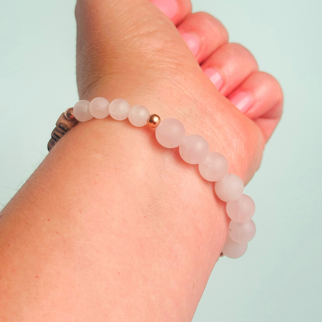 Breathwork bracelet featuring 6mm and 8mm frosted rose quartz crystal beads that follow the 4-7-8 counted breathing method. Also featuring laser engraved wooden letter beads spelling out the word BREATHE. Choose your accent beads from rose gold vermeil, gold vermeil or sterling silver.