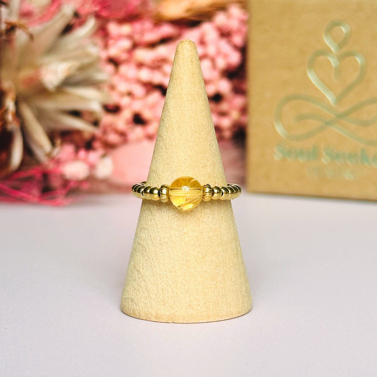 Citrine ring featuring a 6mm round citrine bead, flanked by gold vermeil rondelle beads on a gold vermeil elasticated band. November birthday ideas, November birthday gift, November birthstone ring, stretch ring, November jewellery, born in November