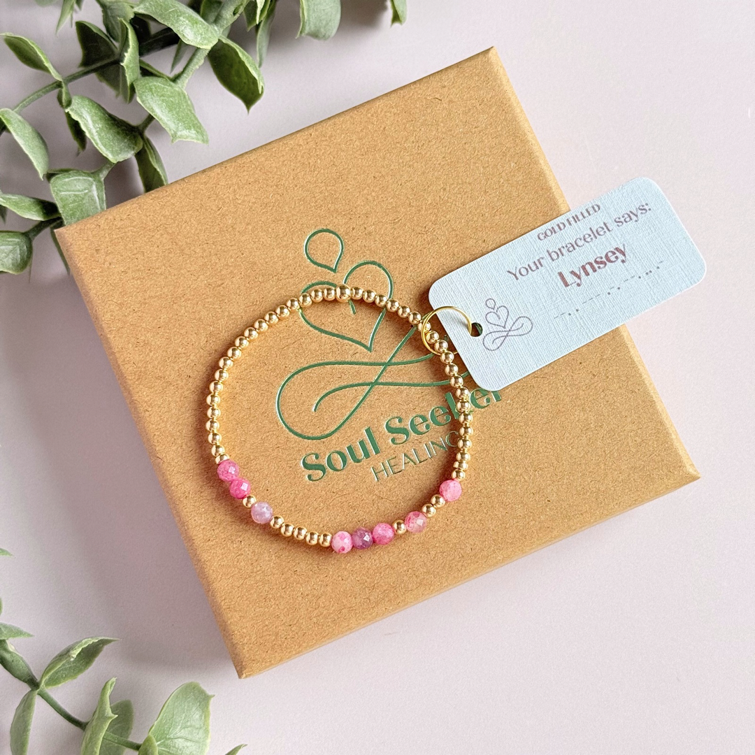 Morse code secret message bracelet spelling out your chosen name in gold filled and pink tourmaline crystal beads. Elasticated with 4mm faceted pink tourmaline beads and 3mm gold filled beads. Custom October birthstone bracelet.
