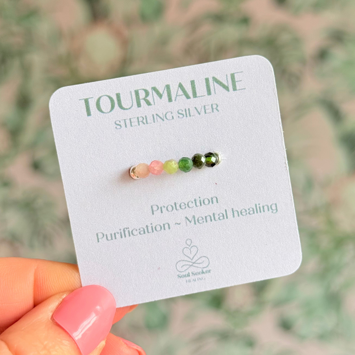 Sterling silver band style ring with multicolour 3mm faceted mixed tourmaline beads in shades of pink, green and black with a beaded band of 2.5 mm sterling silver round . Elasticated for comfort.
