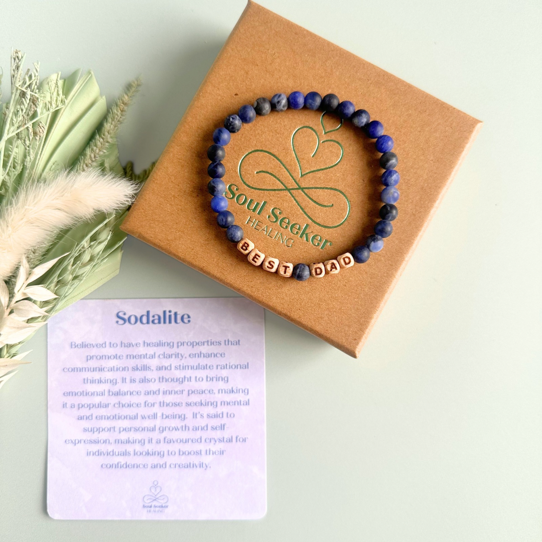 Men’s crystal bracelet with 6mm frosted sodalite gemstone crystal beads and laser engraved wooden letter beads featuring the words best dad or can also be made with any other words or letters.