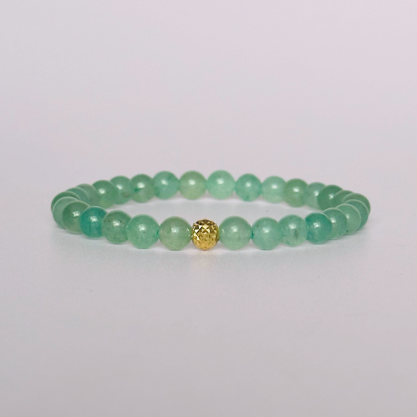 Green aventurine bracelet with a faceted gold vermeil focal bead. A bracelet for prosperity, empathy, abundance and harmony. Made with 6mm beads.