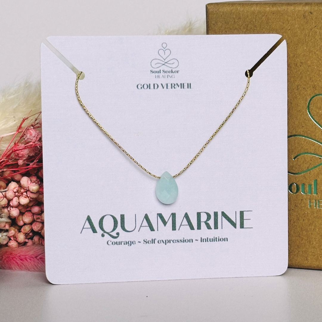 Dainty aquamarine teardrop necklace featuring a 12x8mm faceted aquamarine teardrop bead on a fine gold vermeil cardano beading chain.