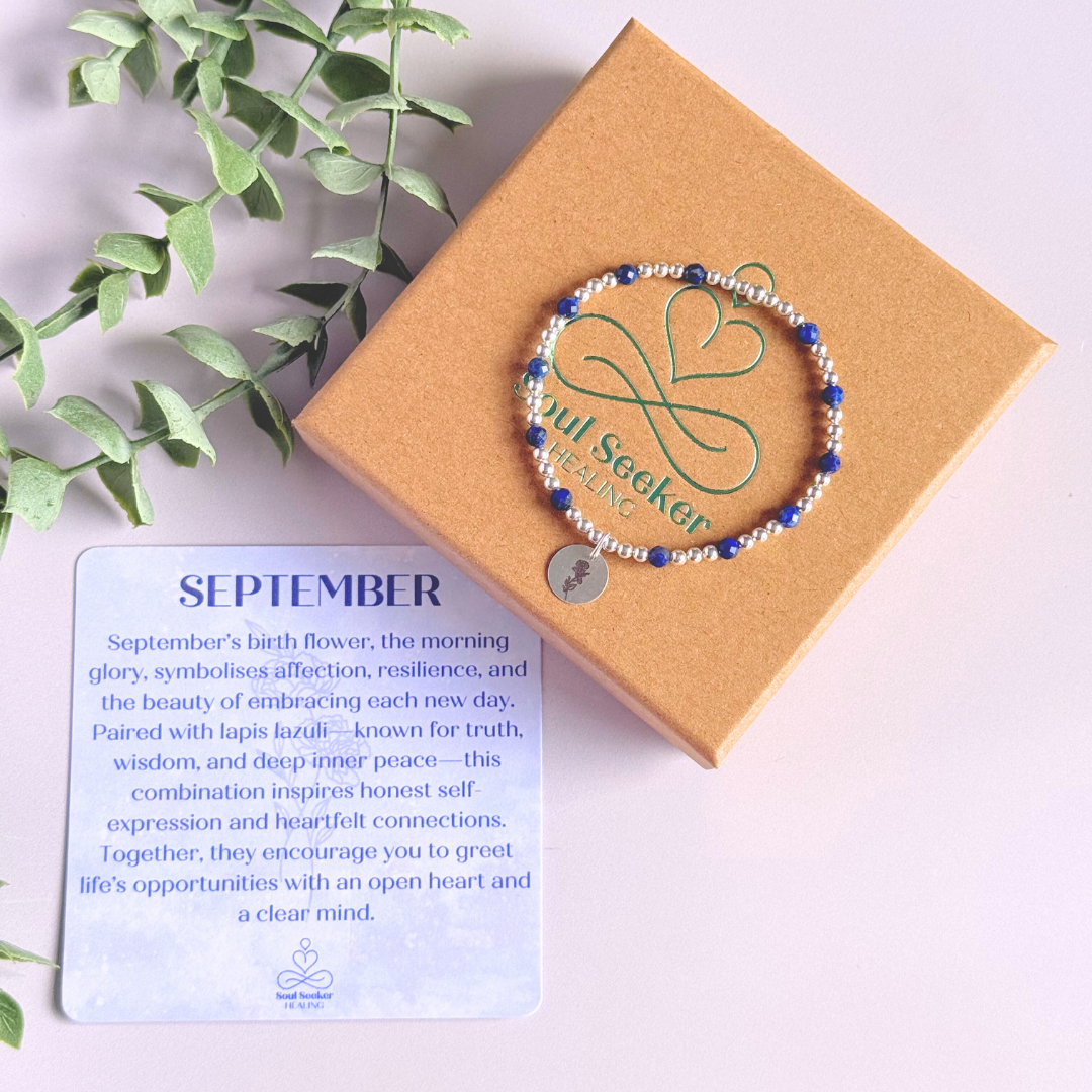 Sterling silver elasticated bracelet featuring 4mm faceted round lapis lazuli beads, separated by 3mm sterling silver round ball beads. Featuring an 11mm sterling silver round disc charm engraved with the September birth flower Morning Glory. One side of the charm can be personalised if required.