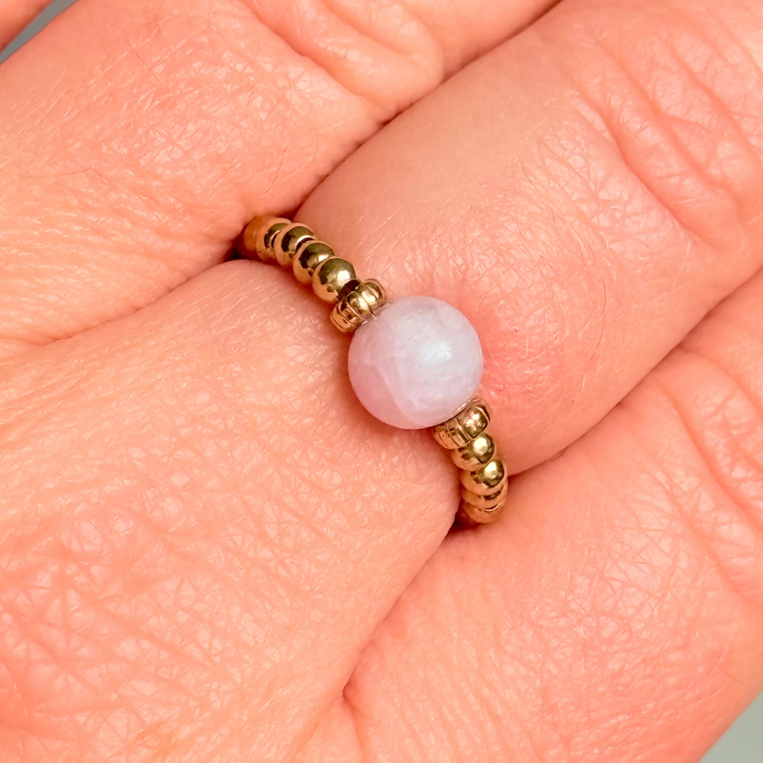 Crystal ring with a 6mm kunzite round bead on an elasticated ring band of 2.5mm gold vermeil ball beads.