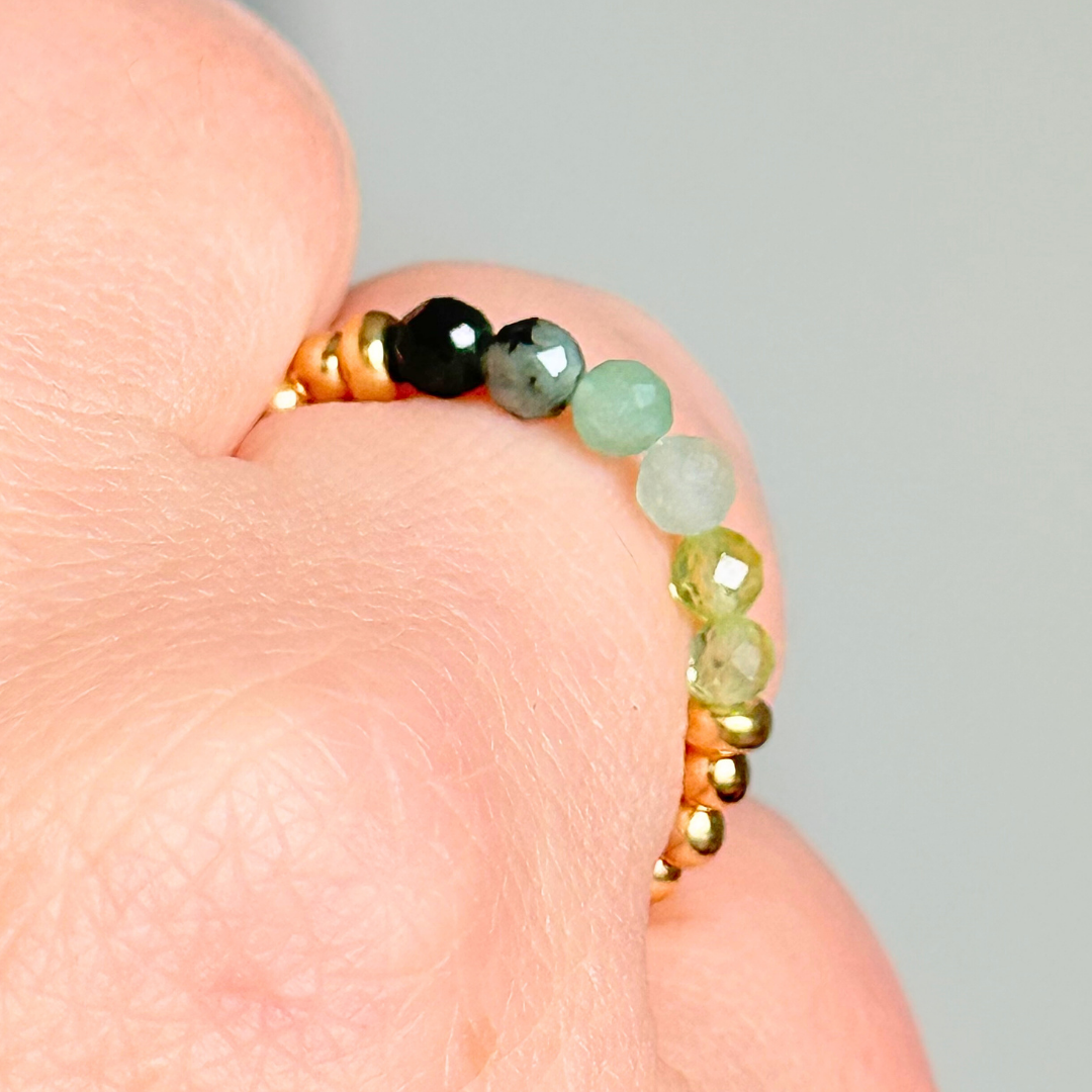 Gold vermeil band style ombré ring with multicolour 3mm faceted peridot, green aventurine and emerald beads with a beaded band of 2.5 mm gold vermeil round beads. Elasticated for comfort.