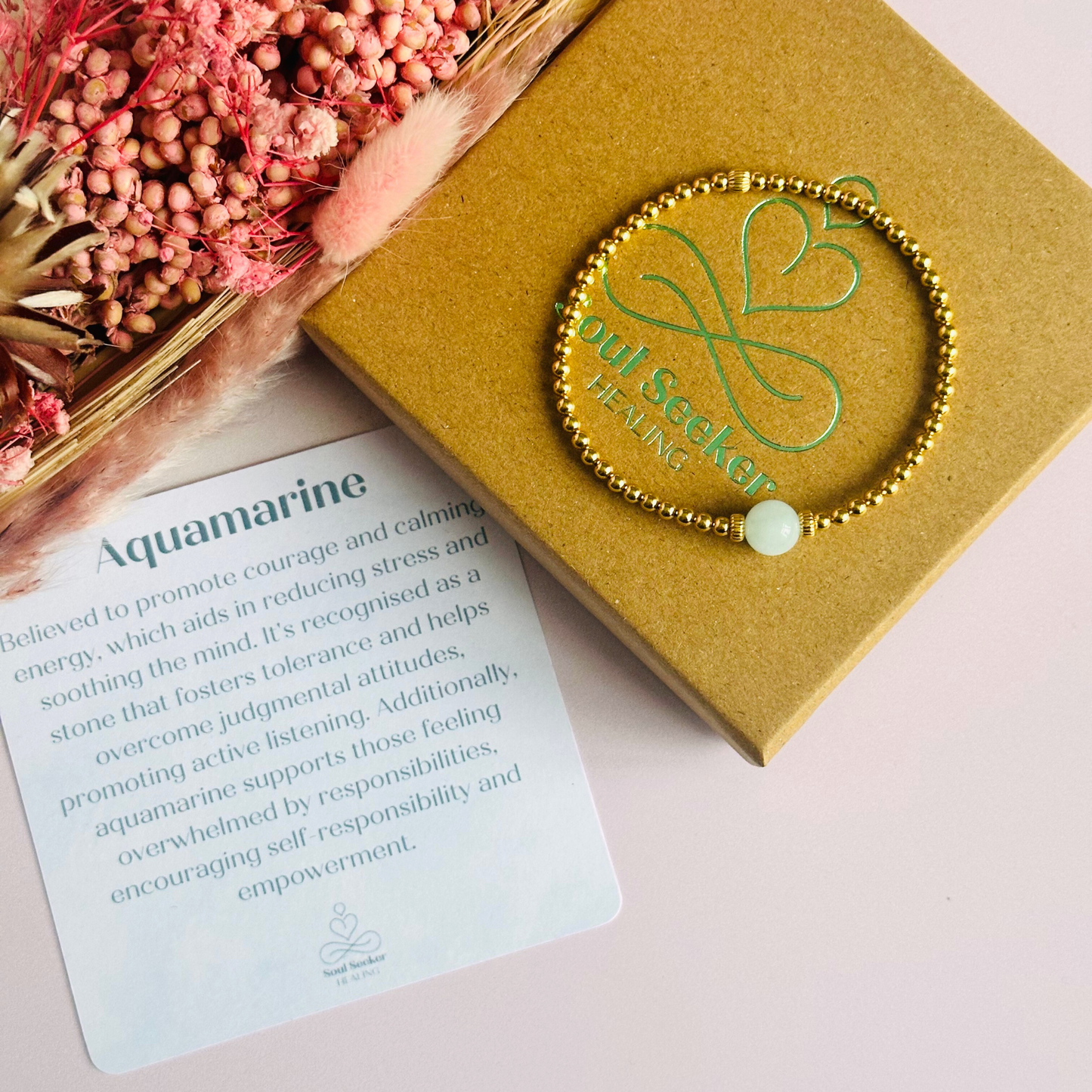 Gold vermeil aquamarine bracelet features an ethically mined 8mm aquamarine bead, flanked by corrugated rondelle beads on a band of 3mm gold vermeil beads. A bracelet to promote courage and self expression.