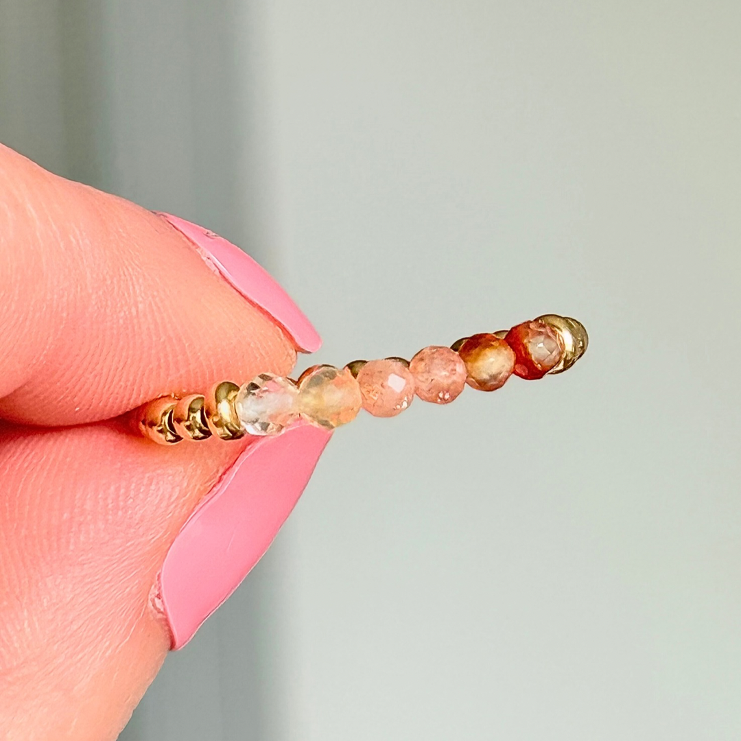Gold vermeil band style ombré ring with multicolour gradient 3mm faceted citrine, sunstone and carnelian beads with a beaded band of 2.5 mm gold vermeil round beads. Elasticated for comfort.