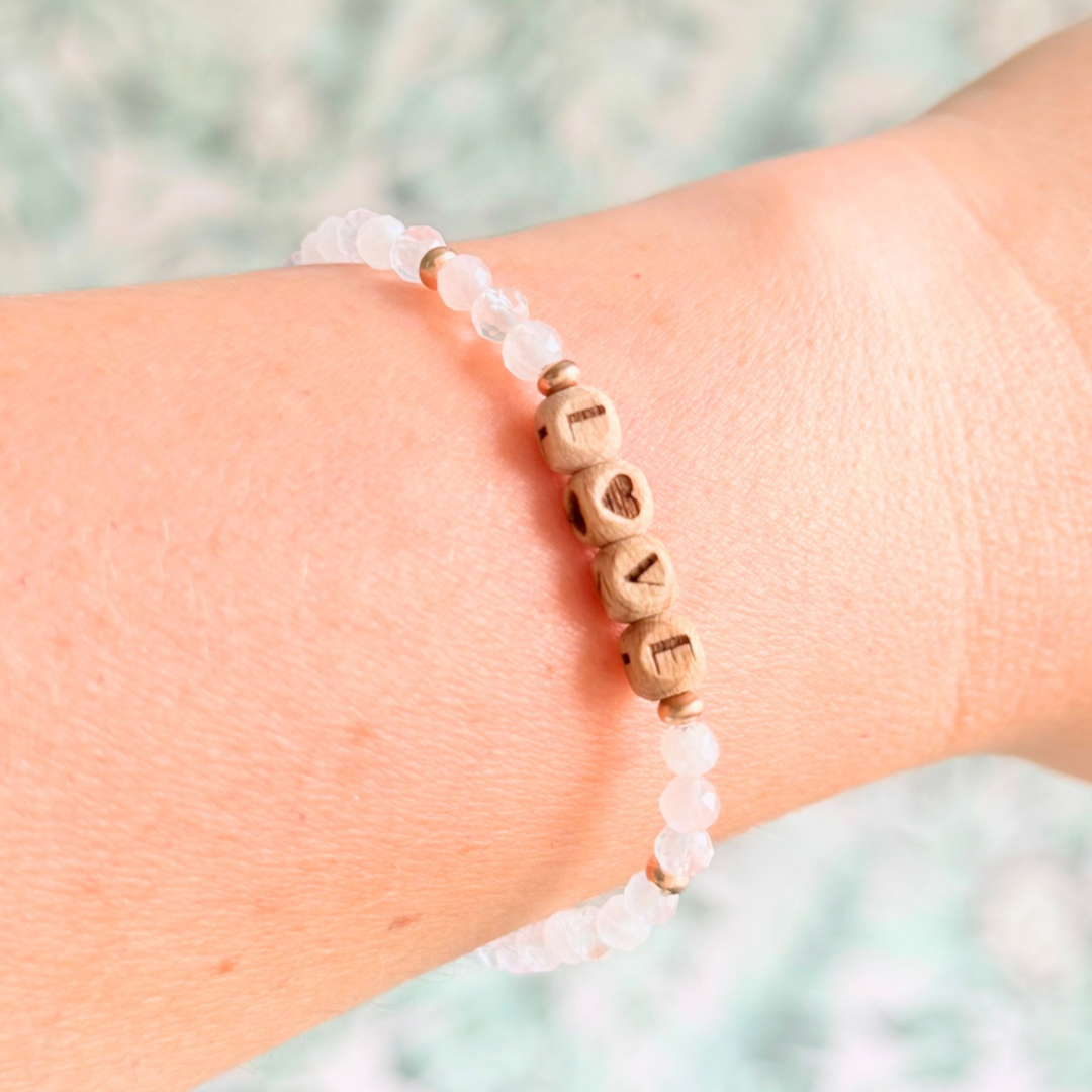 Bracelet featuring 5mm engraved wooden beads which you can personalise with your choice of words, numbers and symbols. The main the band of the bracelet is made with 4mm faceted rose quartz round crystal gemstone beads. Finished with your choice of gold vermeil, sterling silver or rose gold vermeil accent beads.