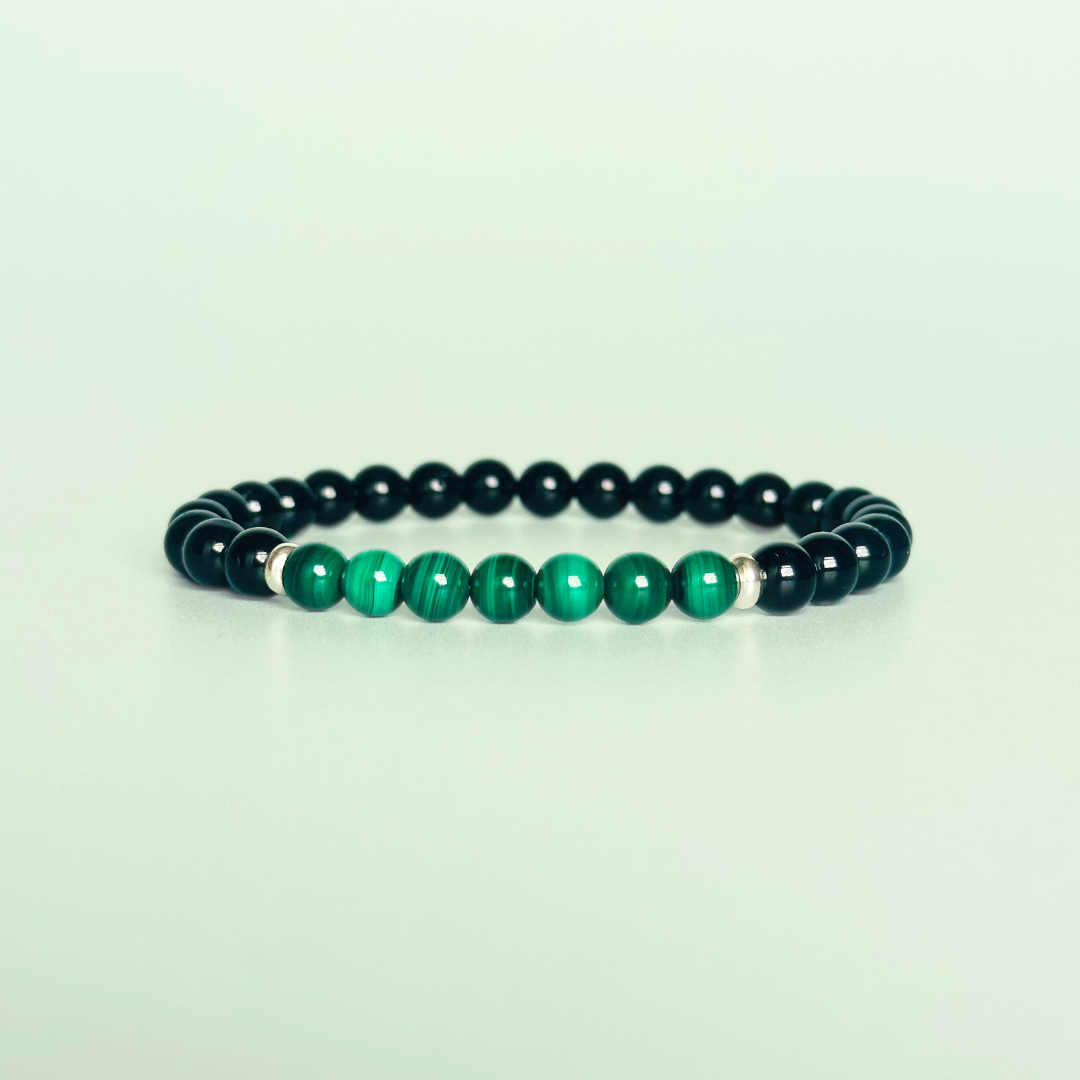 Mens crystal bracelet featuring 6mm black tourmaline beads with 6mm malachite beads, separated by two sterling silver spacer beads.