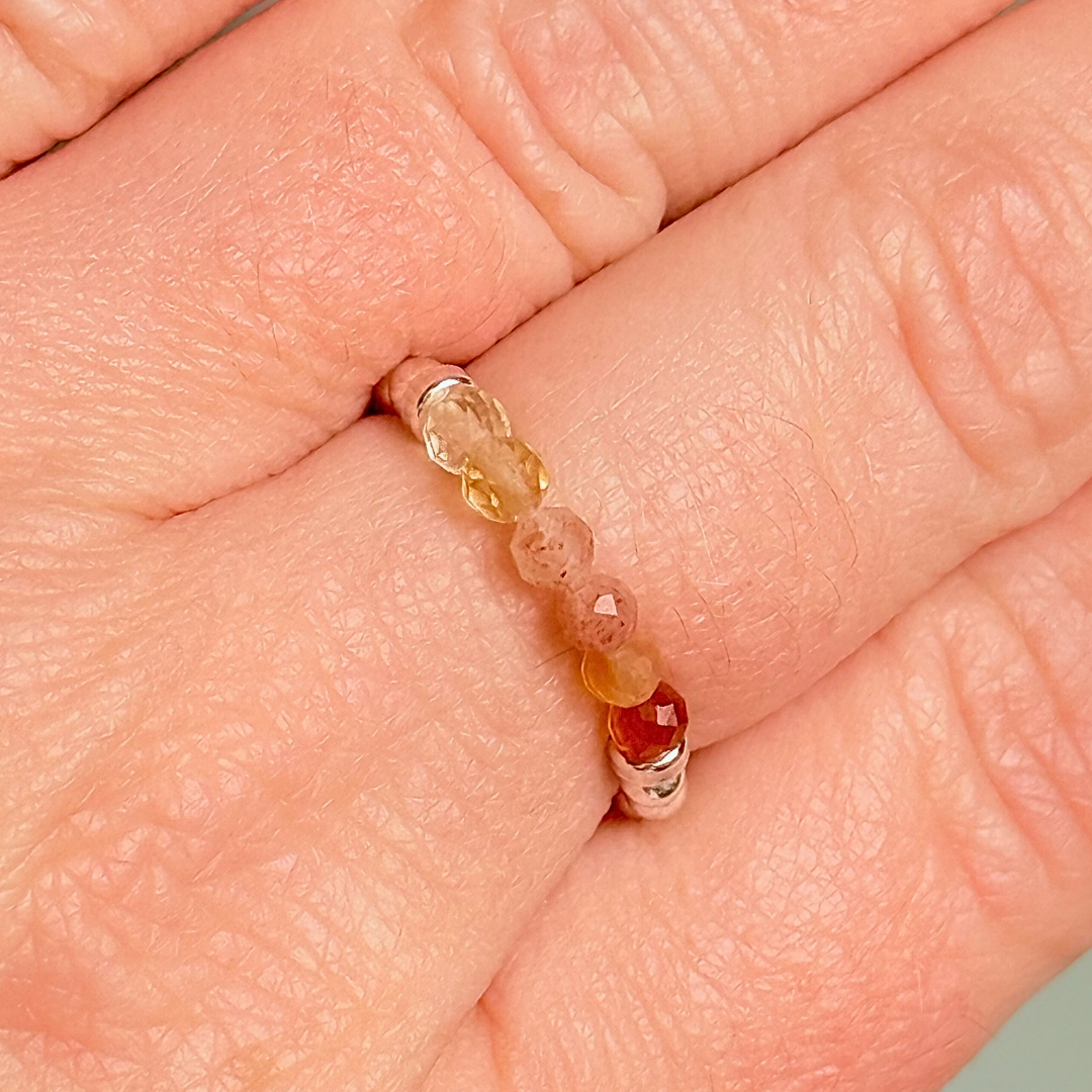 Sterling silver band style ombré ring with multicolour gradient 3mm faceted citrine, sunstone and carnelian beads with a beaded band of 2.5 mm sterling silver round beads. Elasticated for comfort.