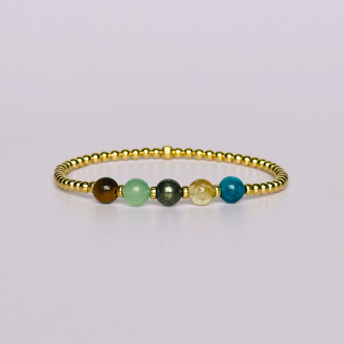 This gold vermeil manifesting bracelet is made with a selection of five healing crystals all believed to help achieve your dream life. The crystal beads are all 6mm and are on a band of 3mm gold vermeil beads with corrugated accent beads.