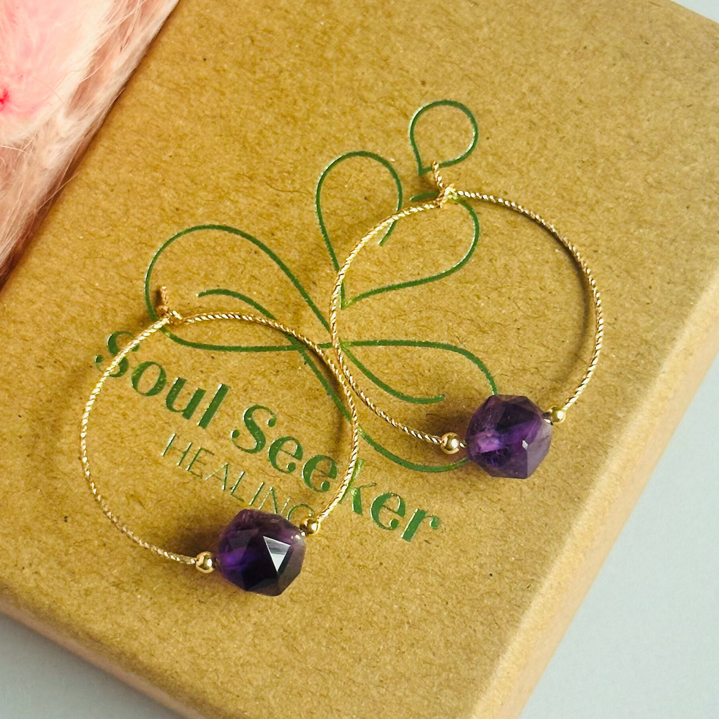 Amethyst gold filled hoop earrings featuring 8mm star cut amethyst beads on 25mm sparkle cut gold filled hoops.