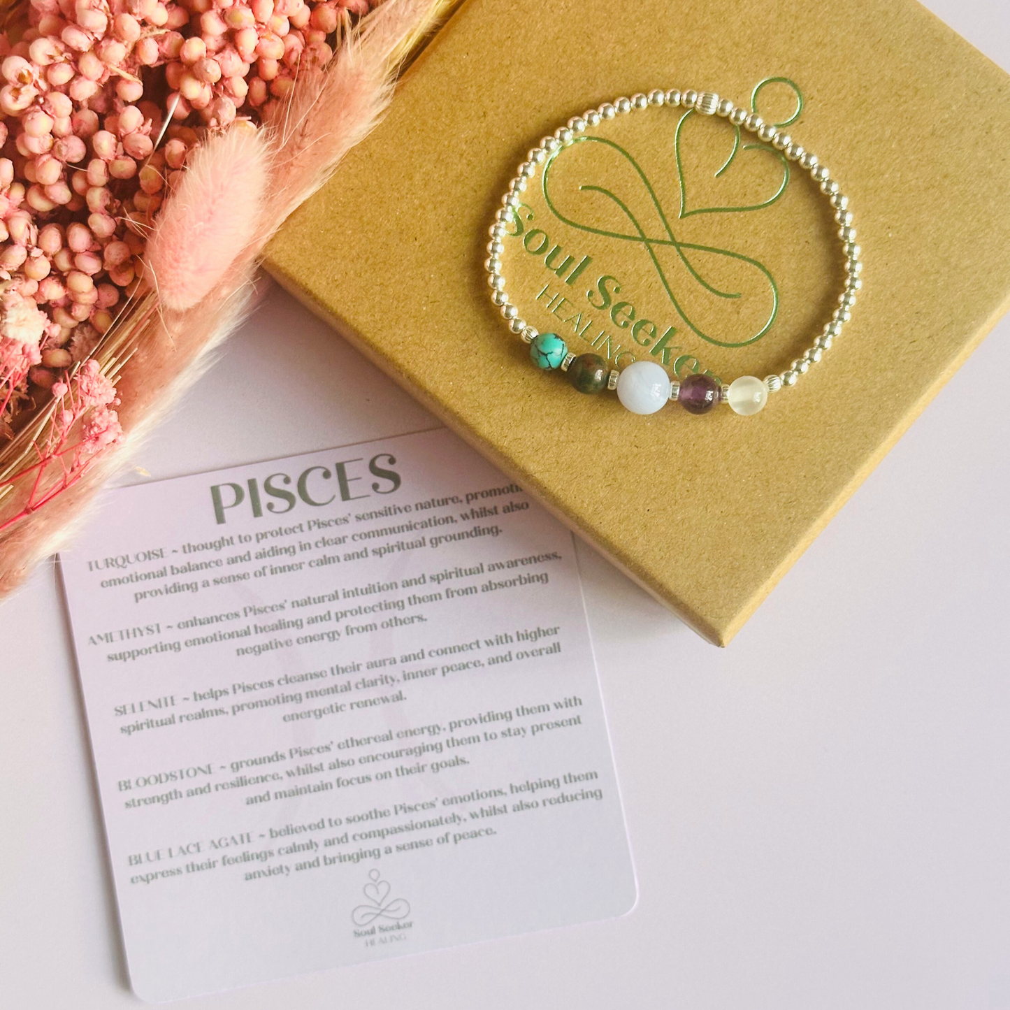 This sterling silver Pisces bracelet is made with a selection of five healing crystals all believed to resonate with the Pisces zodiac sign. The central bead is 8mm, the other four are 6mm. On an elasticated band of 3mm sterling silver beads with corrugated accent beads. Featuring turquoise, bloodstone, blue lace agate, amethyst and selenite.