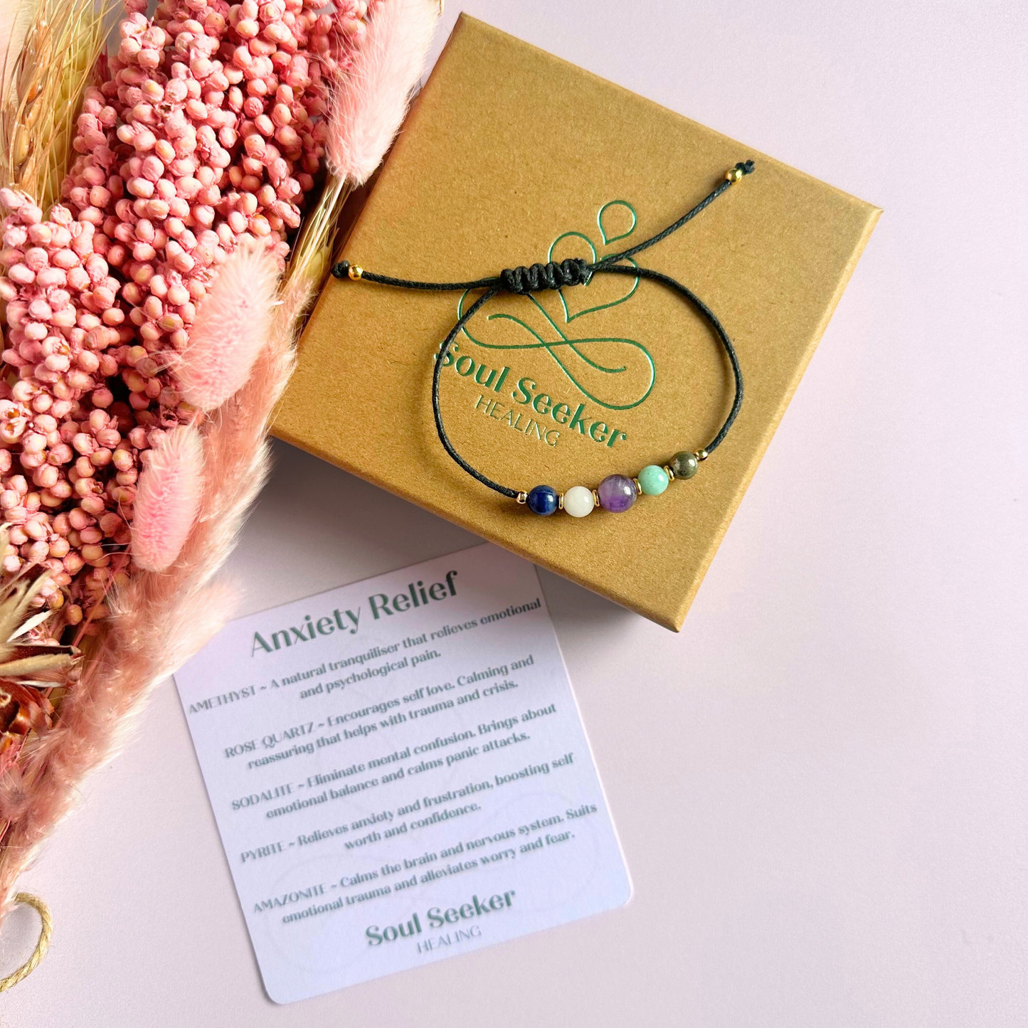 Eco-friendly, waxed cotton cord crystal healing bracelet featuring five crystals each believed to help deal with anxiety. Includes pyrite, amazonite, amethyst, rose quartz and sodalite. Adjustable as it fastens with a sliding macramé clasp. Choose from either sterling silver, gold vermeil or rose gold vermeil accent beads.
