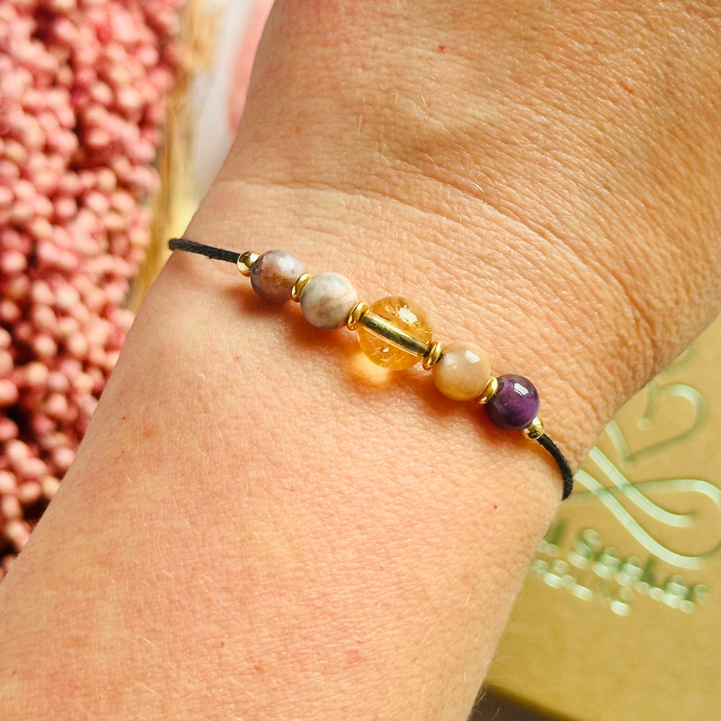 Menopause crystal healing bracelet made with the lepidolite, peach moonstone, citrine, pink zebra jasper and amethyst. Strung on an eco and vegan friendly waxed cotton cord and finished with your choice of sterling silver, rose gold vermeil or gold vermeil accent beads. A sliding macramé clasp makes it adjustable.