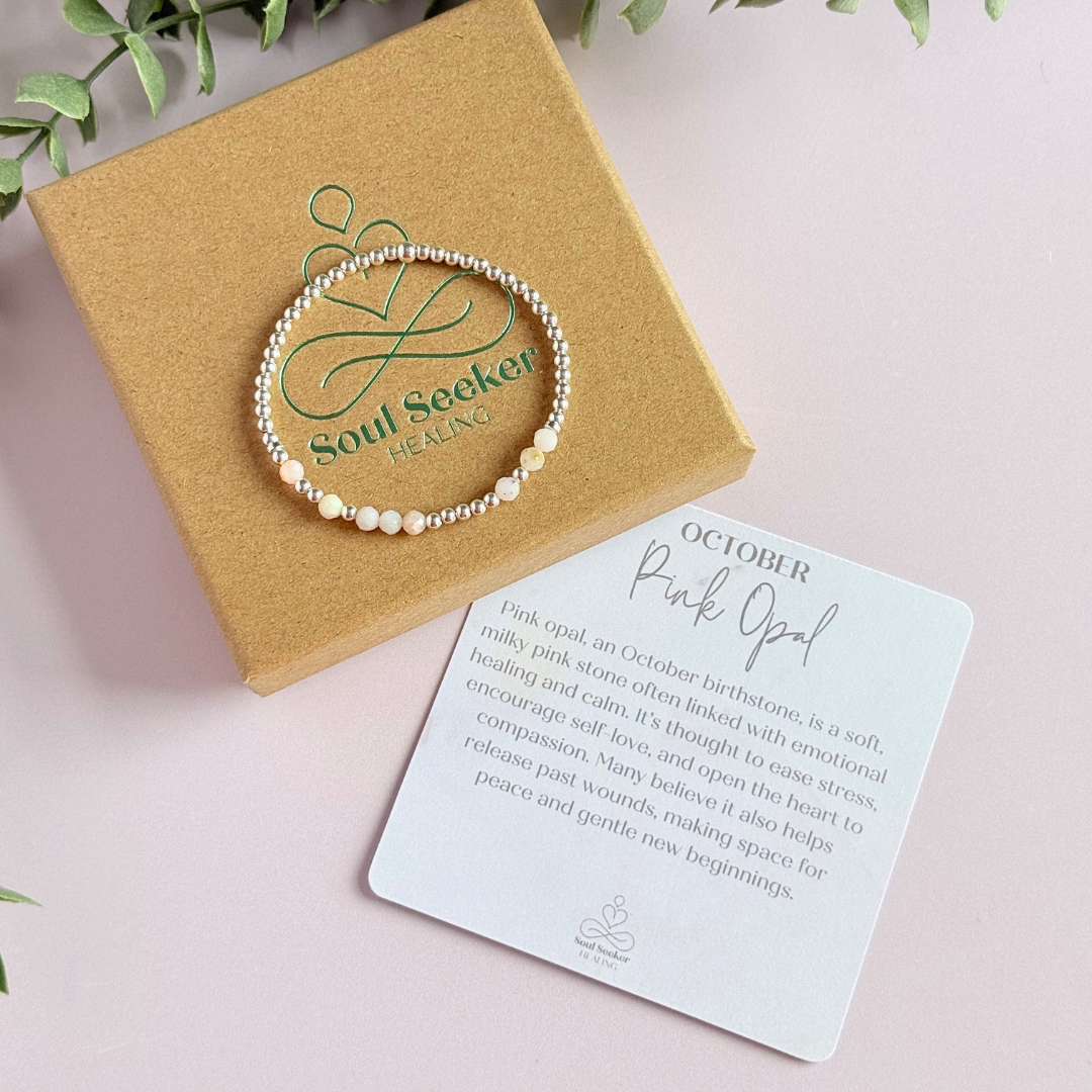 Morse code secret message bracelet spelling out your chosen name in sterling silver and pink opal crystal beads. Elasticated with 4mm faceted pink opal beads and 3mm sterling silver beads. Custom October birthstone bracelet.