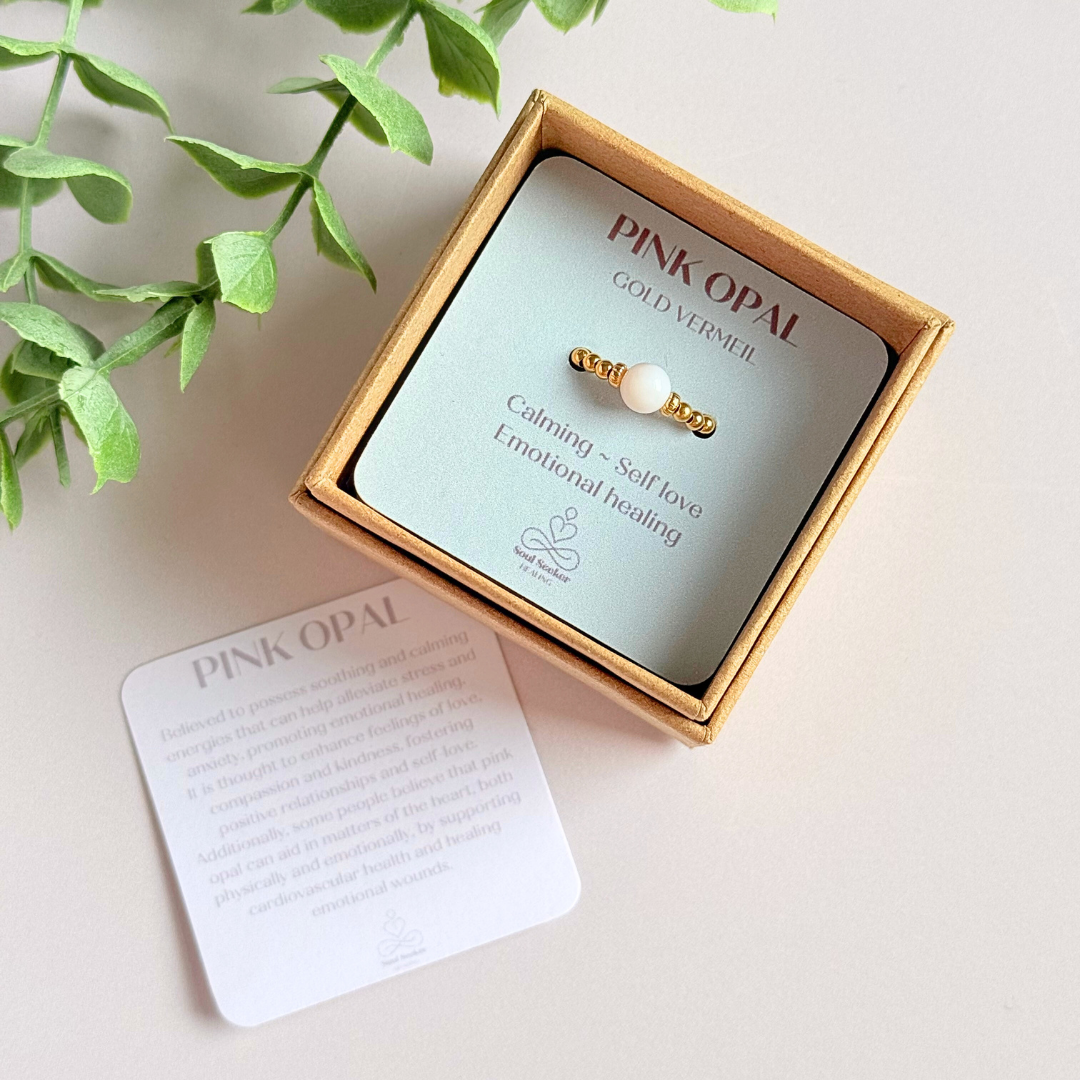 Gold vermeil pink opal October birthstone ring featuring a 6mm smooth, round pink opal bead on a band of 2.5mm gold vermeil ball beads. Elasticated for comfort.