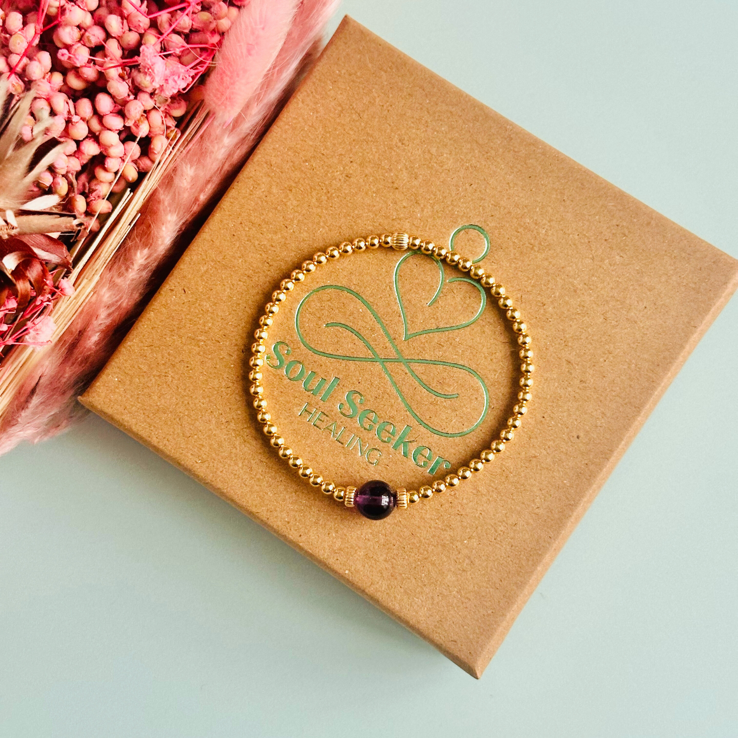 Gold vermeil amethyst bracelet features an ethically mined 8mm amethyst bead, flanked by corrugated rondelle beads on a band of 3mm gold vermeil beads. A bracelet to promote inner peace and calm.
