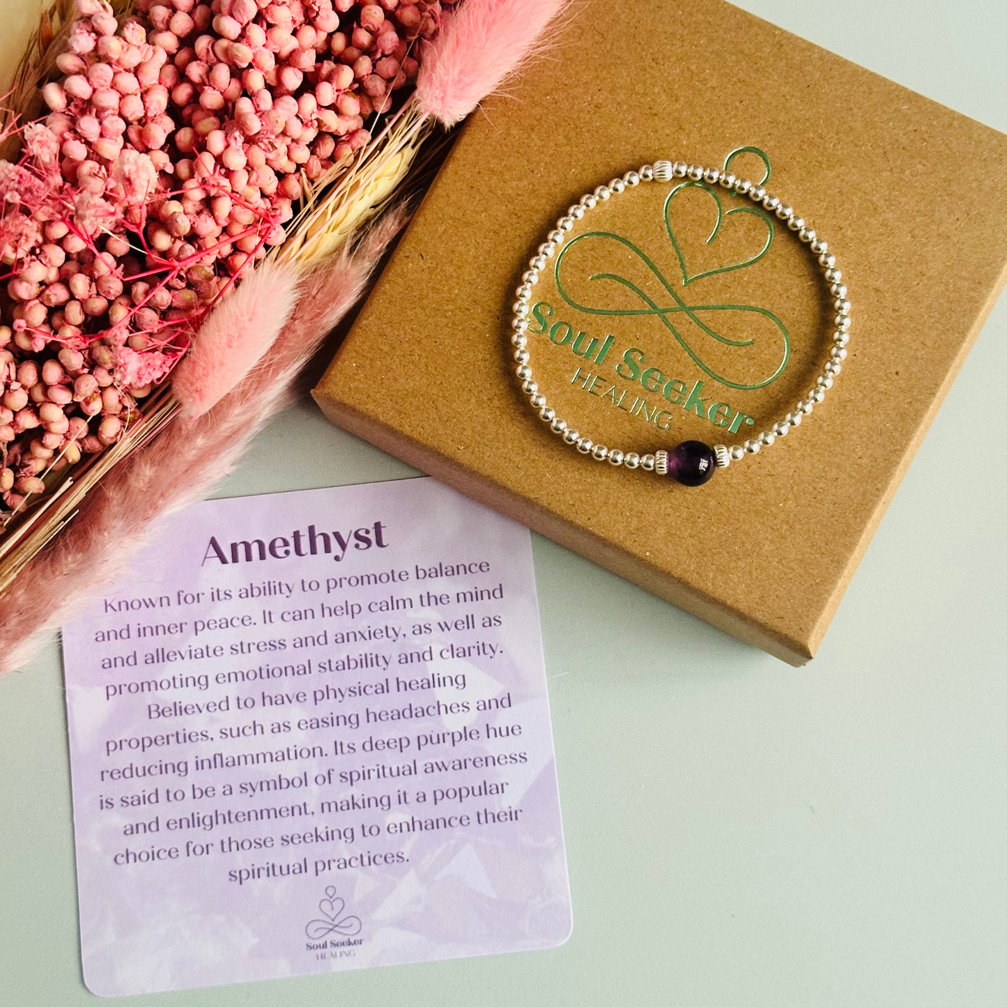 Sterling silver amethyst bracelet features an ethically mined 8mm amethyst bead, flanked by corrugated rondelle beads on a band of 3mm sterling silver beads. A bracelet to promote inner peace and calm.