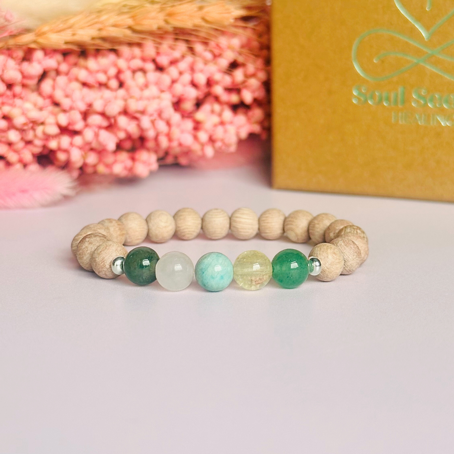 Spring crystal raw rosewood essential oil diffuser bracelet with moss agate, rose quartz, citrine, amazonite and green aventurine.