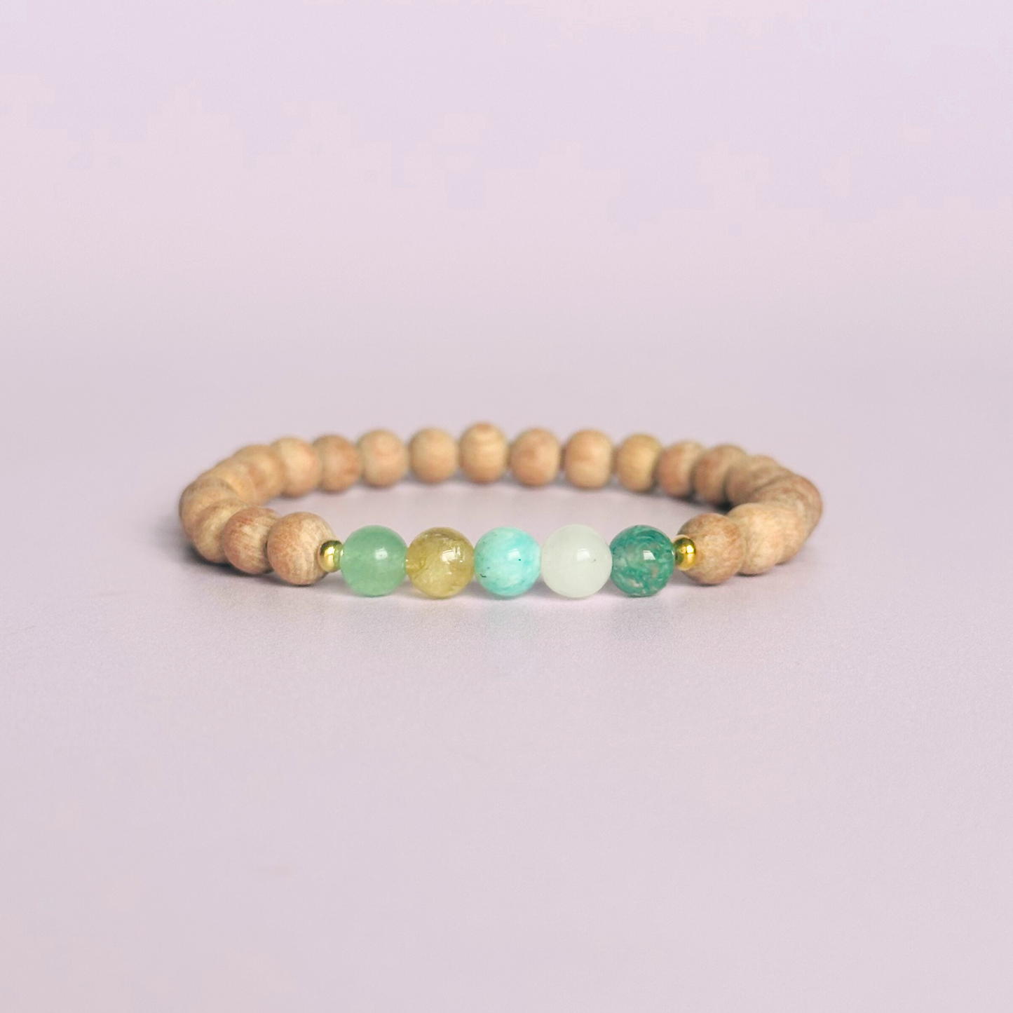 Spring crystal raw rosewood essential oil diffuser bracelet with moss agate, rose quartz, citrine, amazonite and green aventurine.