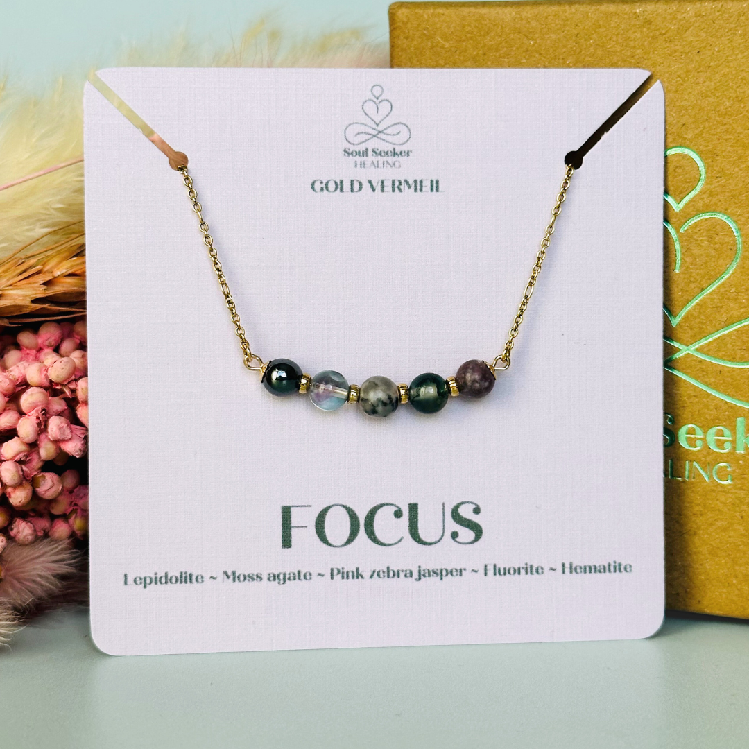 A dainty focus crystal necklace made with a selection of five healing crystals all believed to help you stay focused. On a fine, gold vermeil figaro chain, which fastens with a gold vermeil bolt clasp. Featuring corrugated gold vermeil spacer beads and accented with daisy shaped bead caps.