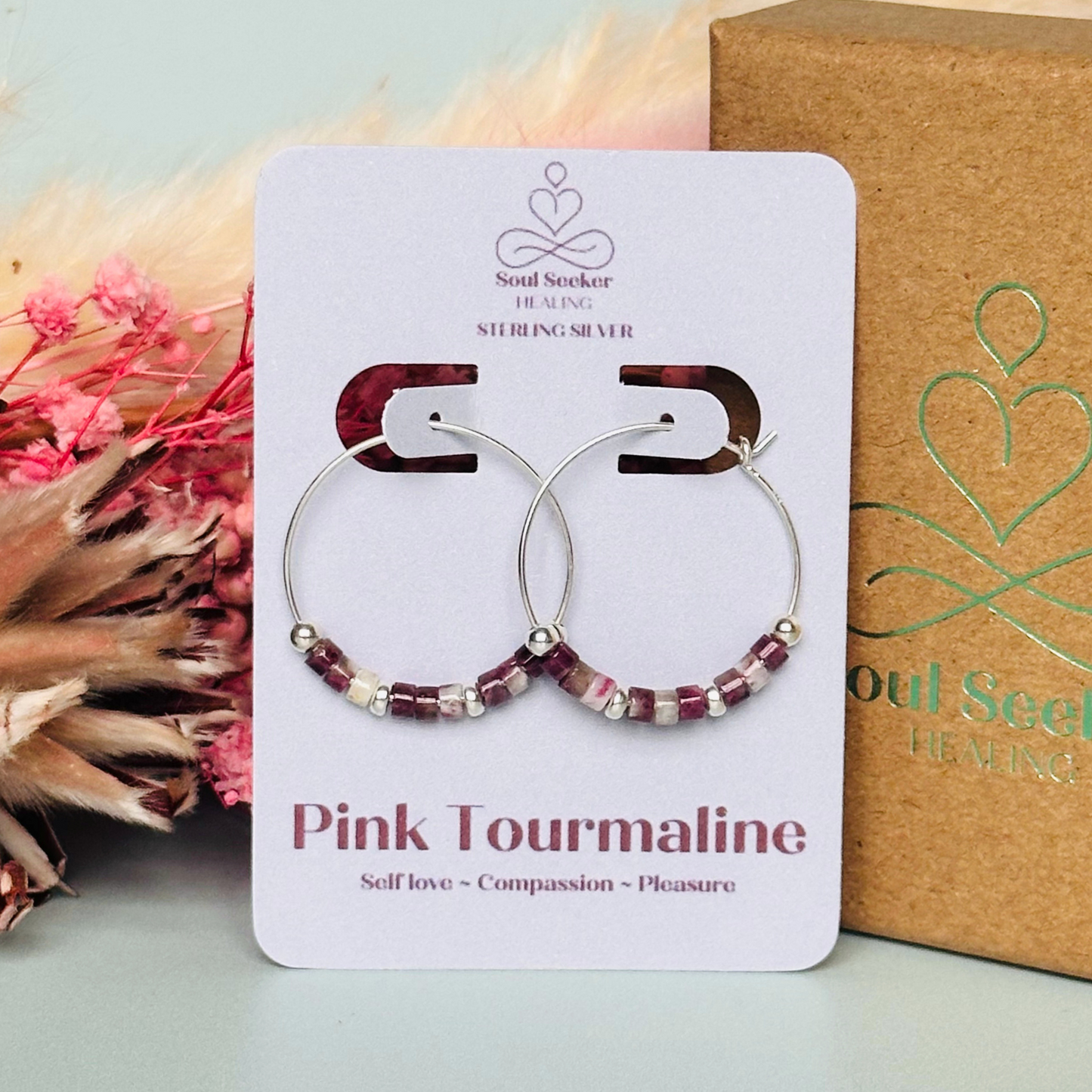 Pink tourmaline sterling silver hoop earrings made with pink tourmaline heishi beads on 25mm sterling silver hoops.