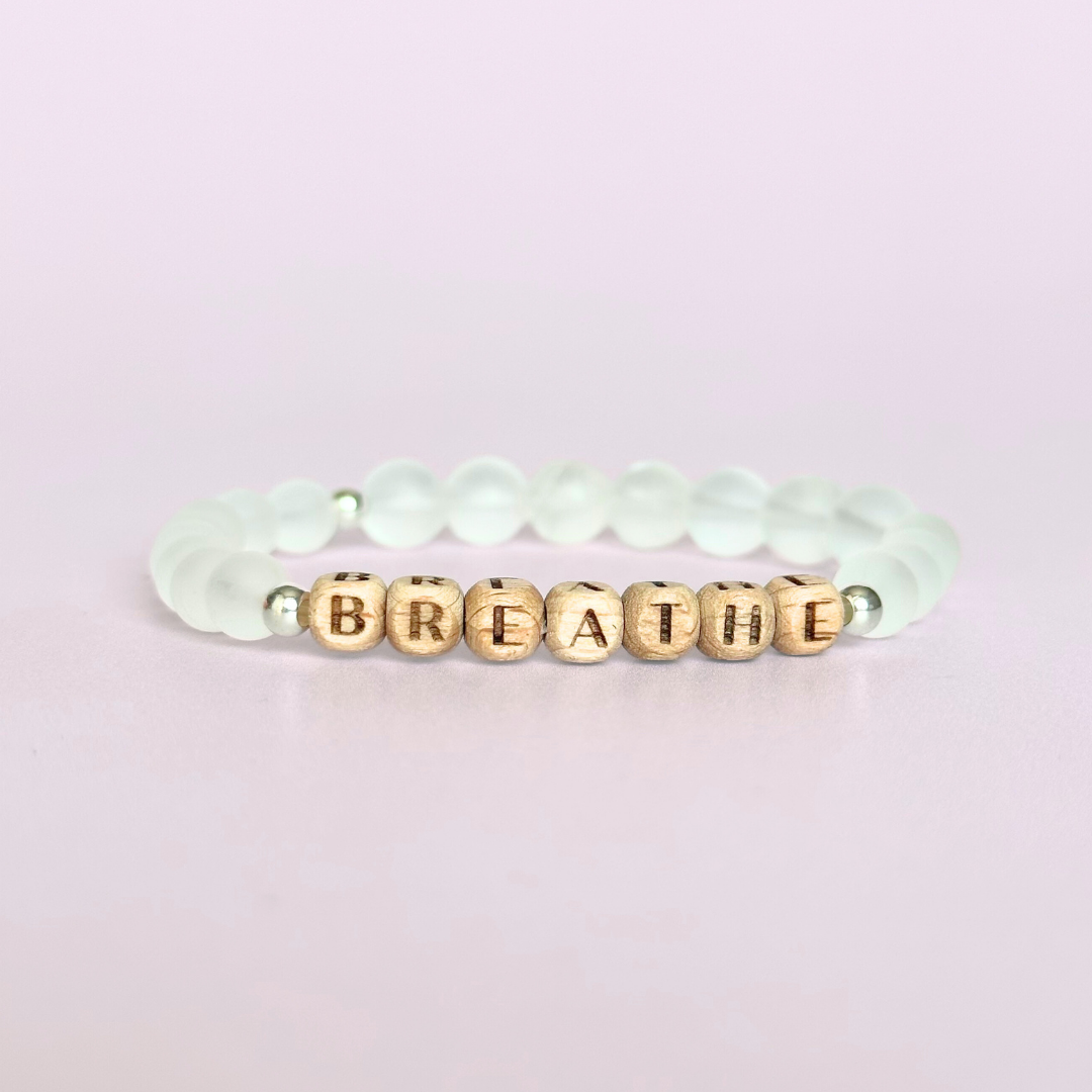 Breathwork bracelet featuring 6mm and 8mm frosted clear quartz crystal beads that follow the 4-7-8 counted breathing method. Also featuring laser engraved wooden letter beads spelling out the word BREATHE. Choose your accent beads from rose gold vermeil, gold vermeil or sterling silver.