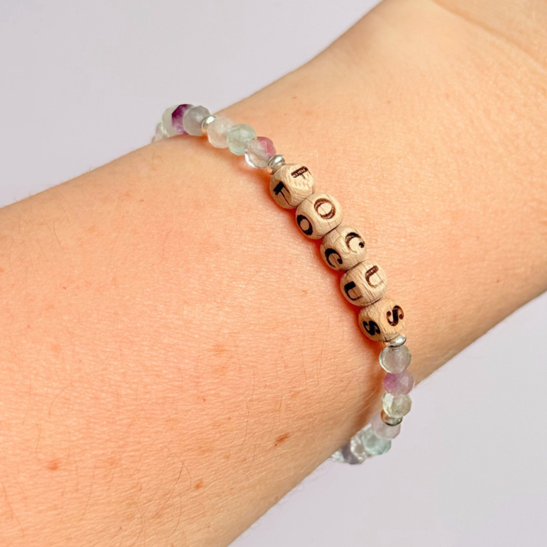 Bracelet featuring 5mm engraved wooden beads, which you can personalise with your choice of words, numbers and symbols. The main the band of the bracelet is made with 4mm faceted fluorite round crystal gemstone beads. Finished with your choice of gold vermeil, sterling silver or rose gold vermeil accent beads.