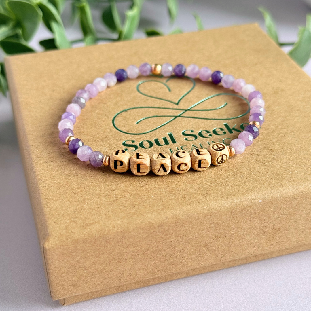 Bracelet featuring 5mm engraved wooden beads which you can personalise with your choice of words, numbers and symbols. The main the band of the bracelet is made with 4mm faceted lepidolite round crystal gemstone beads. Finished with your choice of gold vermeil, sterling silver or rose gold vermeil accent beads.