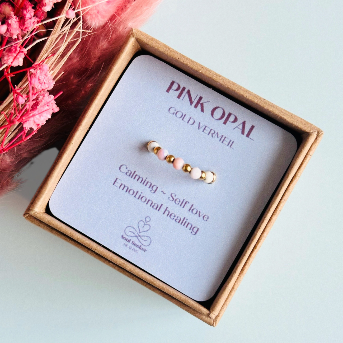 Birthstone ring featuring 5 3mm. Faceted Peruvian pink opal beads on an elasticated band of 3mm gold vermeil round beads, pink opal is an October birth stone so this makes a perfect October birthday gift.