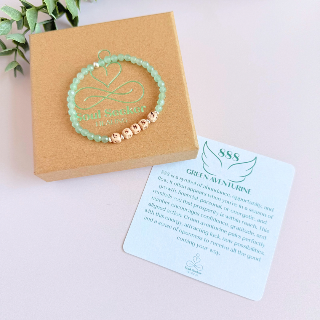 Bracelet featuring engraved wooden 888 angel number and wing beads, on the band of 4mm faceted green aventurine round crystal gemstone beads. Finished with your choice of gold vermeil, sterling silver or rose gold vermeil accent beads.