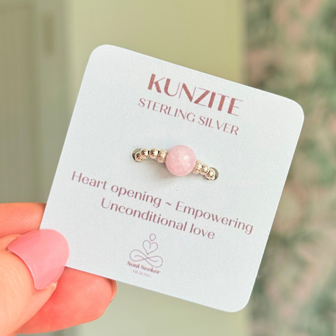 Crystal ring with a 6mm kunzite round bead on an elasticated ring band of 2.5mm sterling silver ball beads.