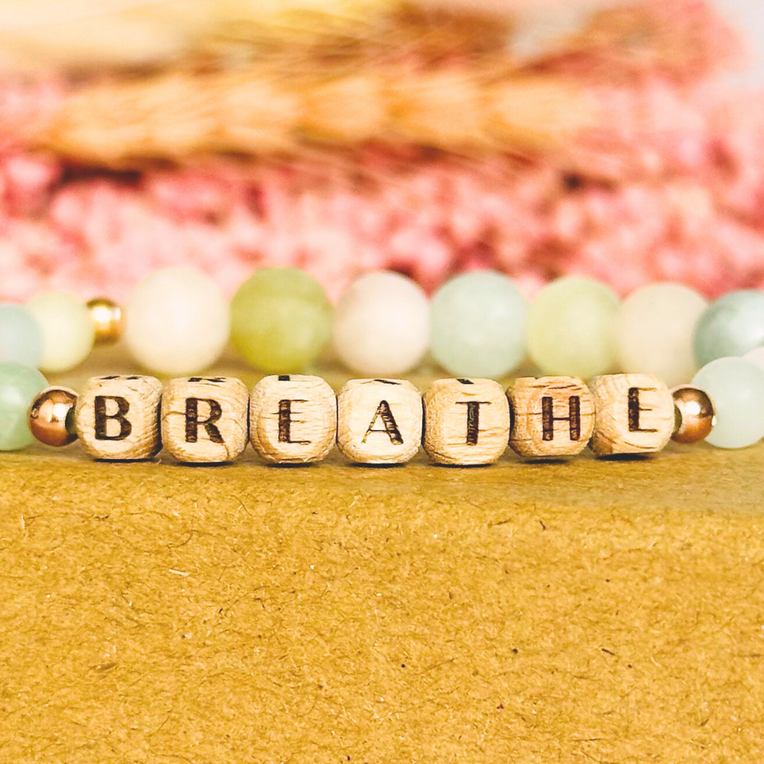 Breathwork bracelet featuring 6mm and 8mm frosted crystal beads that follow the 4-7-8 counted breathing method. Also featuring laser engraved wooden letter beads spelling out the word BREATHE. Choose your accent beads from rose gold vermeil, gold vermeil or sterling silver.