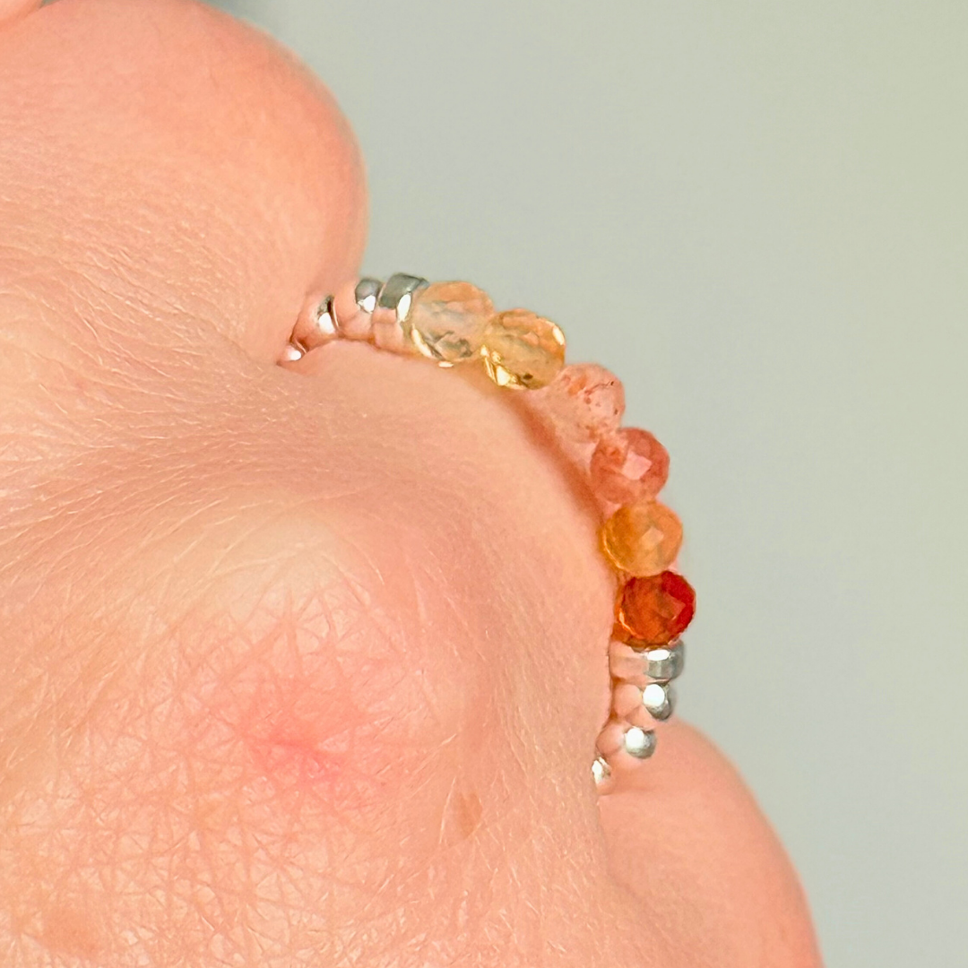Sterling silver band style ombré ring with multicolour gradient 3mm faceted citrine, sunstone and carnelian beads with a beaded band of 2.5 mm sterling silver round beads. Elasticated for comfort.