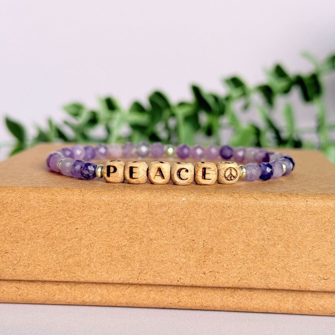 Bracelet featuring 5mm engraved wooden beads which you can personalise with your choice of words, numbers and symbols. The main the band of the bracelet is made with 4mm faceted lepidolite round crystal gemstone beads. Finished with your choice of gold vermeil, sterling silver or rose gold vermeil accent beads.