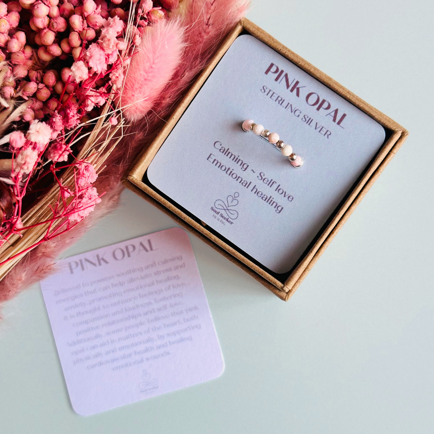 Birthstone ring featuring 5 3mm. Faceted Peruvian pink opal beads on an elasticated band of 3mm sterling silver round beads, pink opal is an October birth stone so this makes a perfect October birthday gift.